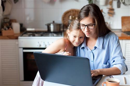 Mother and daughter on laptop 